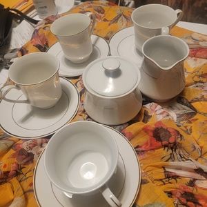 Potter and Smith tea set with cream and sugar pieces.